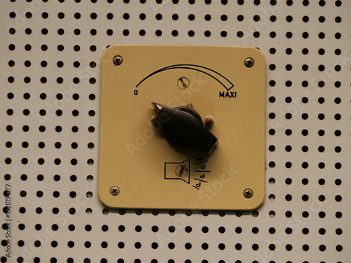 Small knob with a black handle sits on a white background