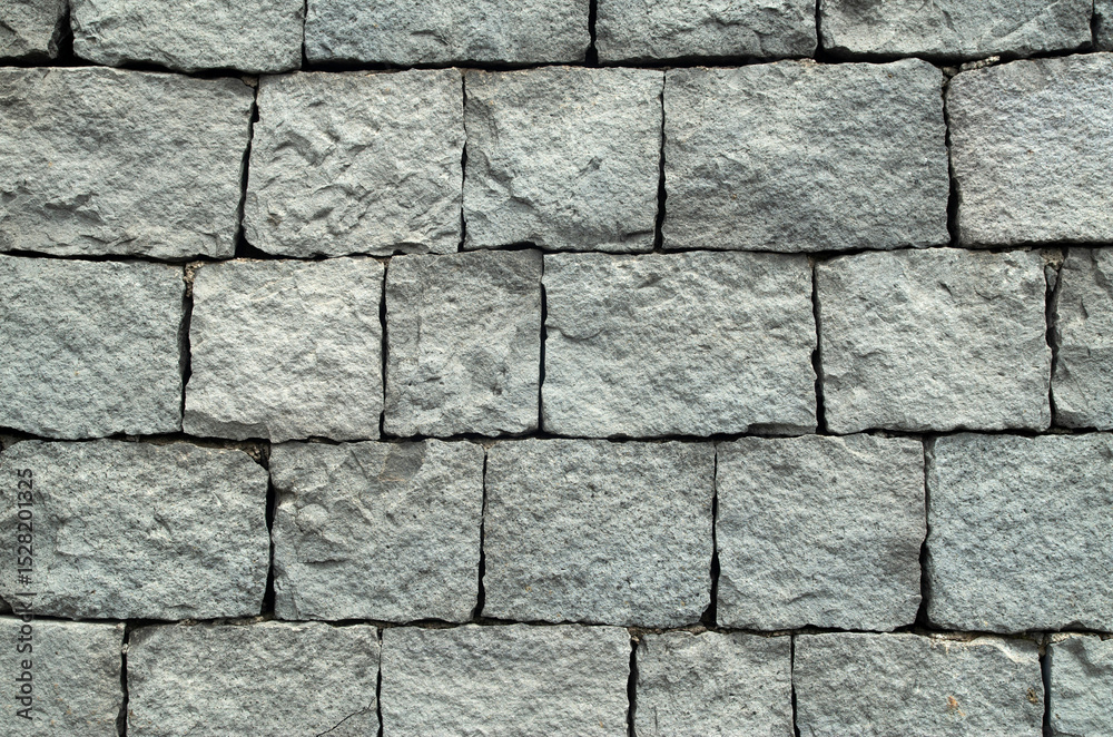 Fototapeta premium New gray andesite stone wall closeup