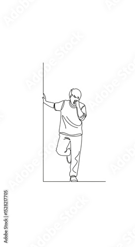Upset man leaning against the wall with one leg raised in a contemplative mood
