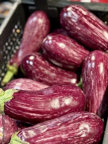 Wallpaper Mural Ripe dark eggplants in a cardboard box for sale in an elite supermarket. Healthy eating. Close-up Torontodigital.ca