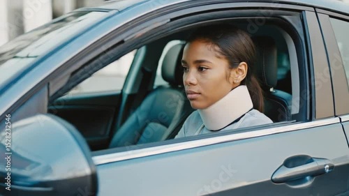 Driver with a neck brace.