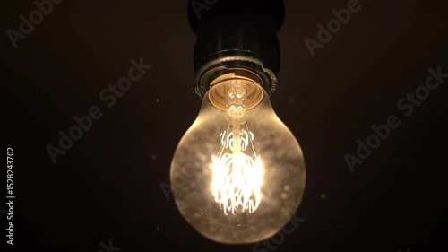 Single Light Bulb Flickering in Dark Room