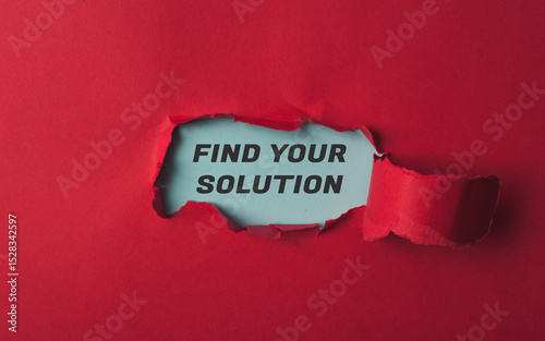 Torn red paper with words Find your solution symbolizing challenge and determination