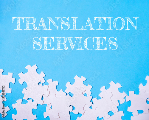 Blue background with white puzzle pieces and the words translation services