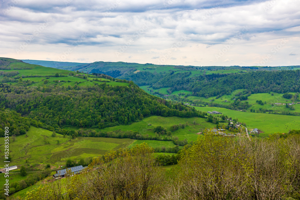 Fototapeta premium Landscape of the Maronne Valley under the clouds from Salers