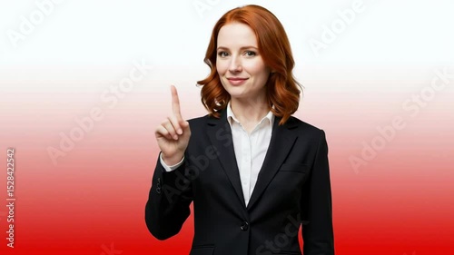 Smiling businesswoman with red hair pointing finger against pink background. Professional female executive making presentation gesture confidently. Corporate success concept for leadership training