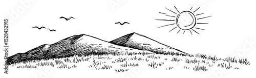 sunny field with distant mountain peaks
