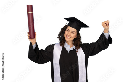 Jubilant graduate in academic regalia lifting diploma, marking academic success against clean white backdrop