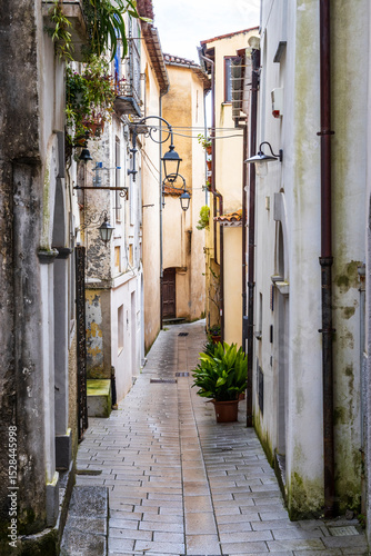Italy, Basilicata, Maratea. Narrow walkway between buildings.