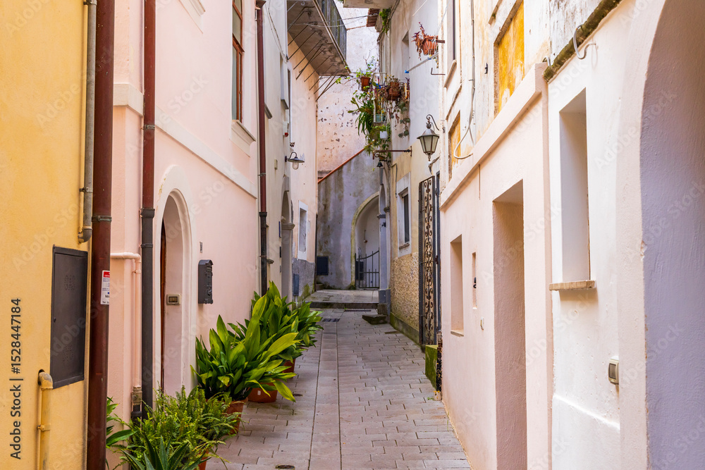Fototapeta premium Italy, Basilicata, Maratea. Narrow walkway between buildings.