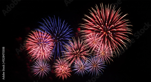 Dense red and blue fireworks covering the night sky – powerful visual representation of 4th of July patriotic celebrations in America.

