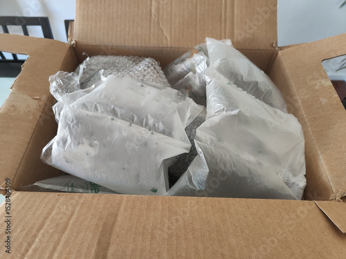 A box of salad air is opened and the salad air bags are inside