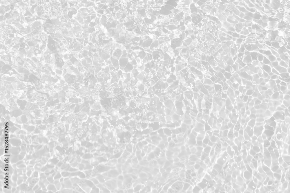 Fototapeta premium White water with ripples on the surface. Defocus blurred transparent white colored clear calm water surface texture with splashes and bubbles. Water waves with shining pattern texture background.