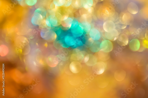 Blurred glowing spots create a golden bokeh effect perfect for joyful holiday and celebratory visual design