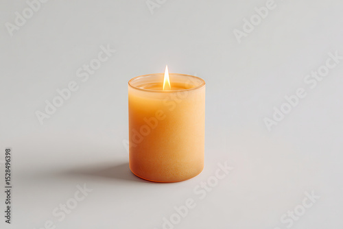 minimalistic candle emitting warm glow on light background