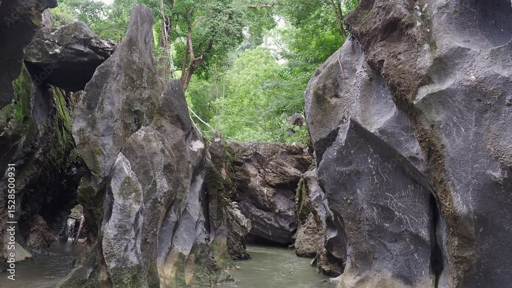 Klong Hin Dam River, natural black stone tunnel Klong Hin Dam River, natural black stone tunnel