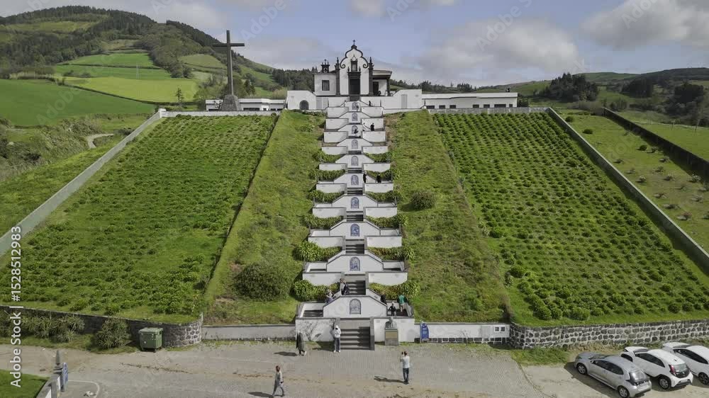 Drone flies up zig zag stairs of Santuario de Nossa Senhora da Paz in Vila Franca do Campo, Sao Miguel, Azores, Portugal