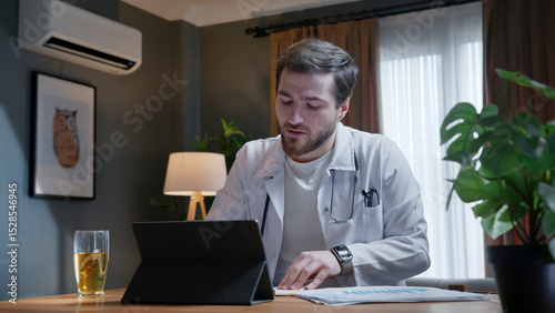 Doctor conducting online consultation from home office