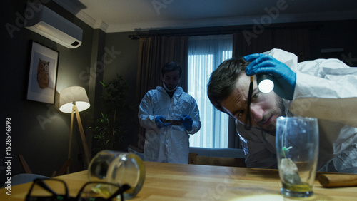 Forensic investigators analyzing evidence at crime scene