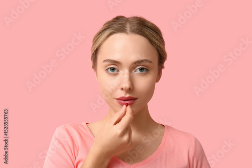 Young woman taking vitamin ...