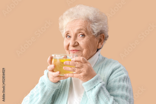 Mature woman with glass cup...