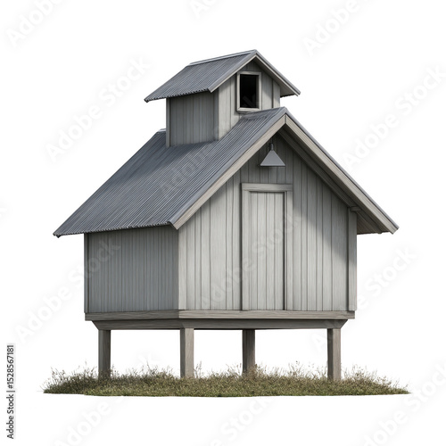 Small, elevated wooden structure with metal roof stands on stilts, surrounded by grass. building features simple design with gabled roof and small window