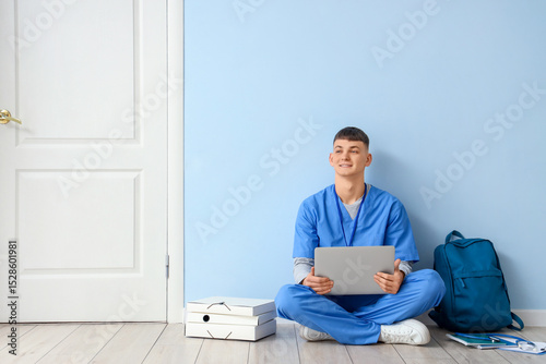 Male medical intern with la...