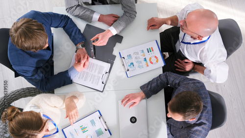 Tableau sur toile The management discusses the details of the contract, top view