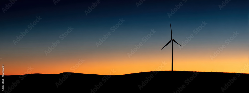 Obraz premium Wind turbine silhouette against vibrant sunset sky evokes sense of tranquility