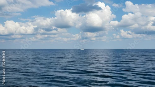 Wallpaper Mural Dark Blue Ocean Waters under Partially Cloudy Blue Sky with a Distant White Boat on the Horizon Torontodigital.ca