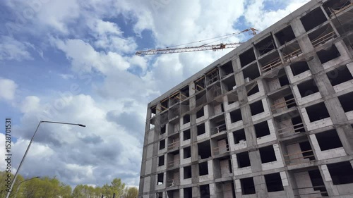 Construction crane building new apartment residential building 