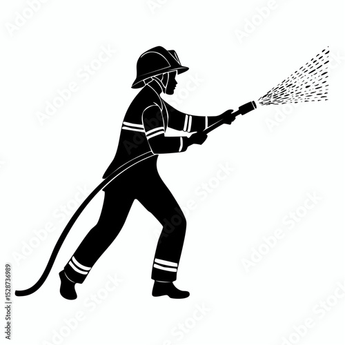 Silhouette of a firefighter in full protective gear extinguishing a fire with water
