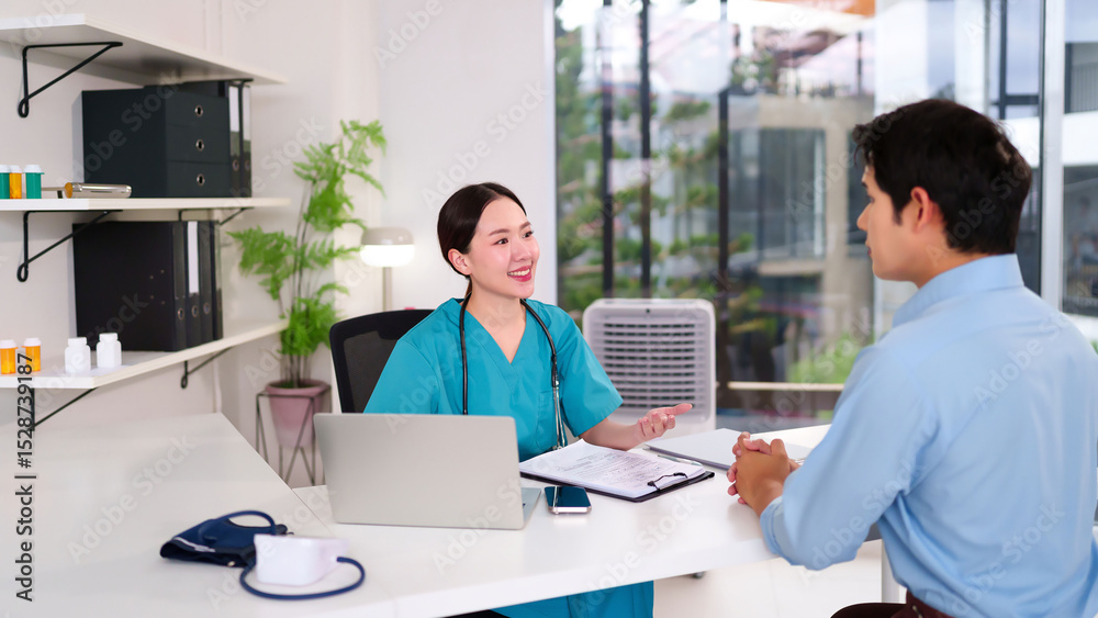 Fototapeta premium Asian Women Doctor Consults with Male Patient in Clinic Office Medical Exam Healthcare Professional Explaining Diagnosis Treatment Options