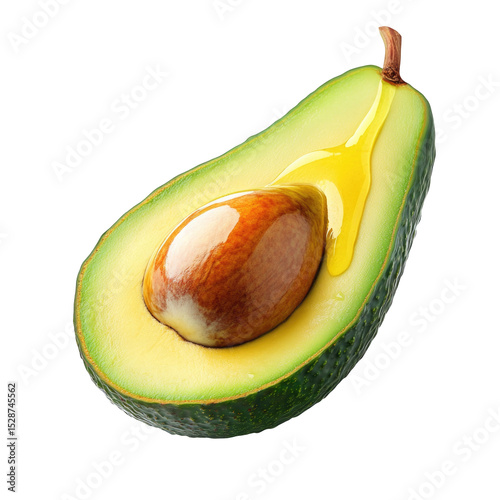 Avocado half with seed and oil dripping isolated on black background macro photo shot