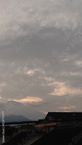 scenery of the gray sky with the roofs of houses