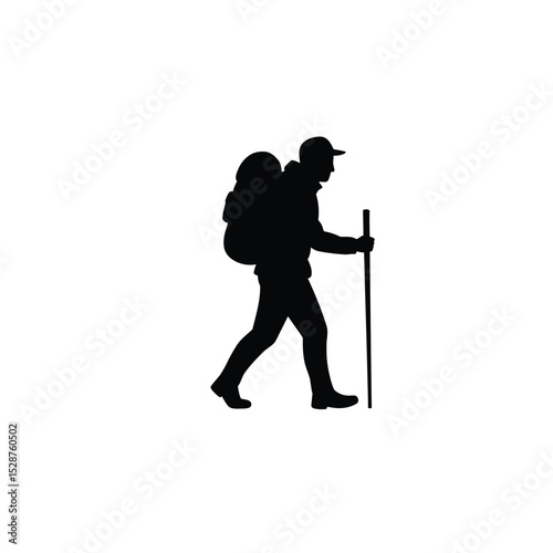Silhouette of a hiker walking with backpack and trekking pole