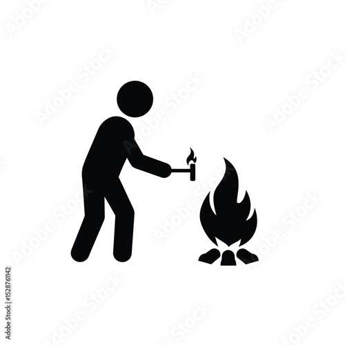 Person starting campfire with flint and steel