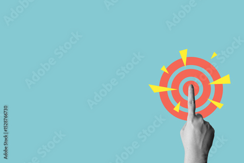 Human hand touching a dartboard on a colored background. Concept of taking action. Collage art
