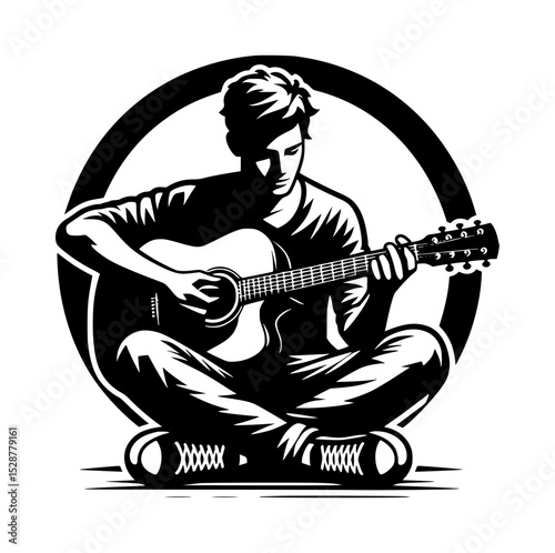 Young man playing acoustic guitar in black and white