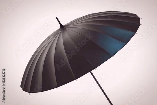 Black umbrella in a light gradient background