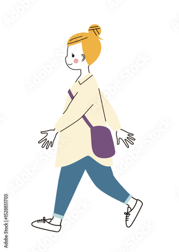 歩いているおだんごヘアの女性