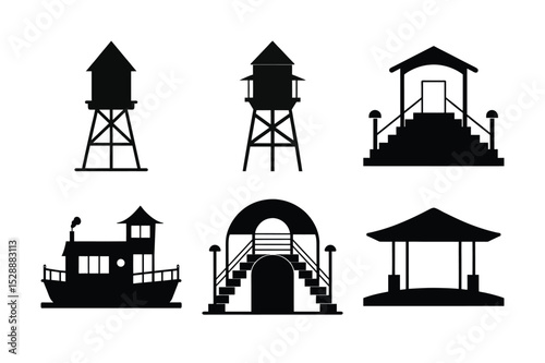 Blue sky over old industrial building and lifeguard tower silhouettes at the beach