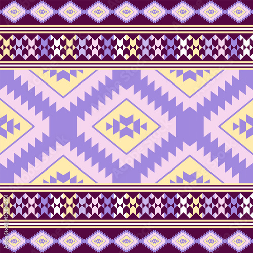 Navajo tribal seamless vector pattern. Native American ornaments. Ethnic southwestern decorative style in purple tones.