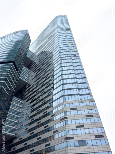 Wallpaper Mural A tall building with many windows and a glass facade Torontodigital.ca