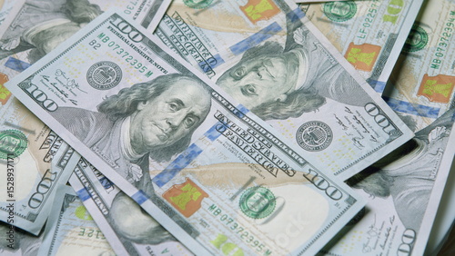 A Stack of Money consisting of U.S. Hundred Dollar Bills neatly arranged and photographed