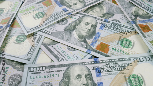 A large stack of U.S. 100 Dollar Bills showcasing abundance and vast financial assets available