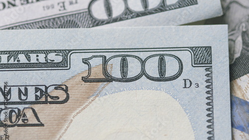 CloseUp of U.S. Hundred Dollar Bills Featuring Detailed Design and Value Indicators