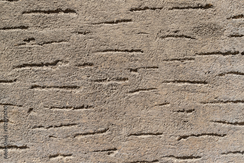 Rough Beige Textured Wall with Irregular Horizontal Patterns