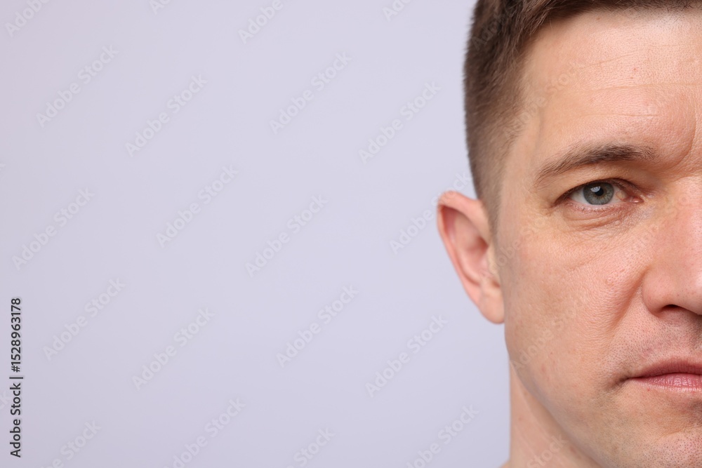 Fototapeta premium Handsome man on light background, closeup. Space for text