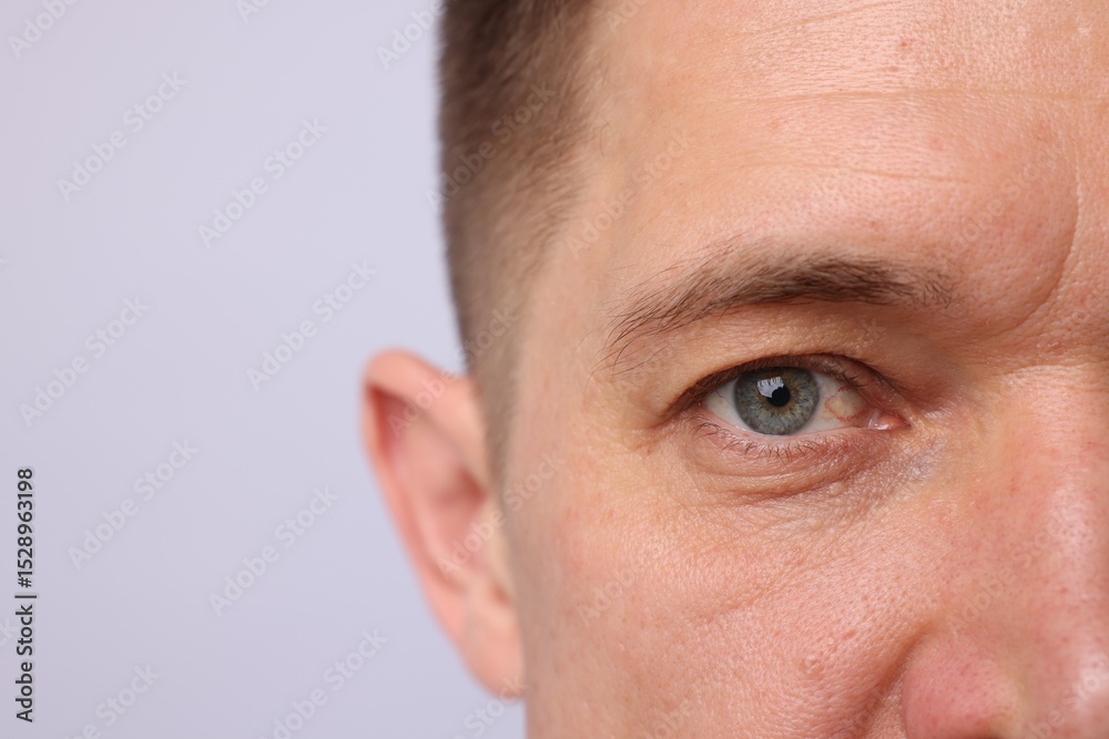 Fototapeta premium Handsome man on light background, closeup view